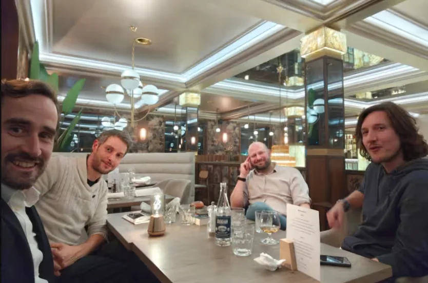 The four members of the nagome team gathered around a table